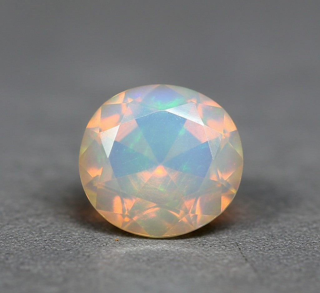 Stunning Faceted Opal Gemstone on Grey Background