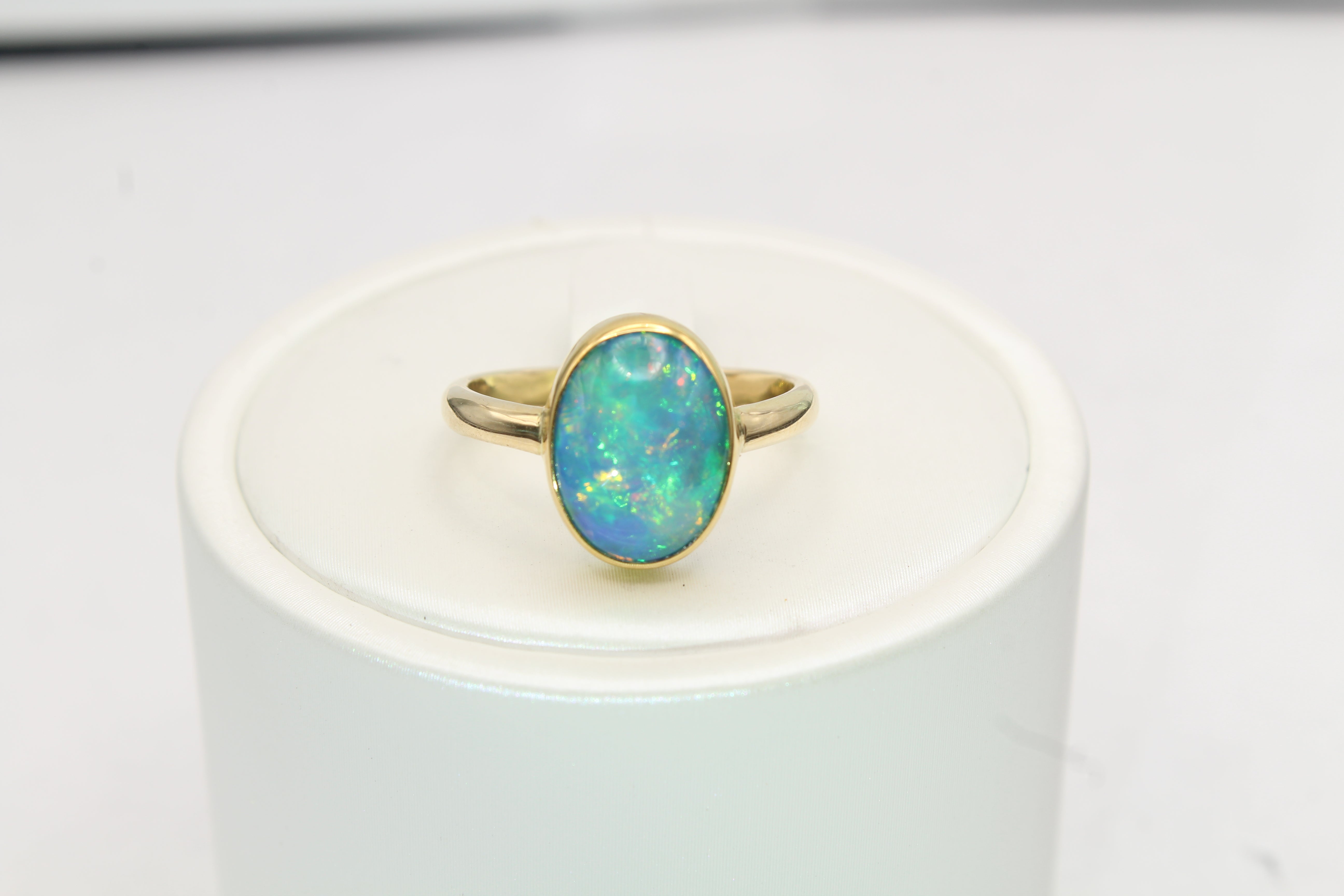 Ethiopian Opal Ring in Solid 14k & 22k Gold | Oval Bezel Set
