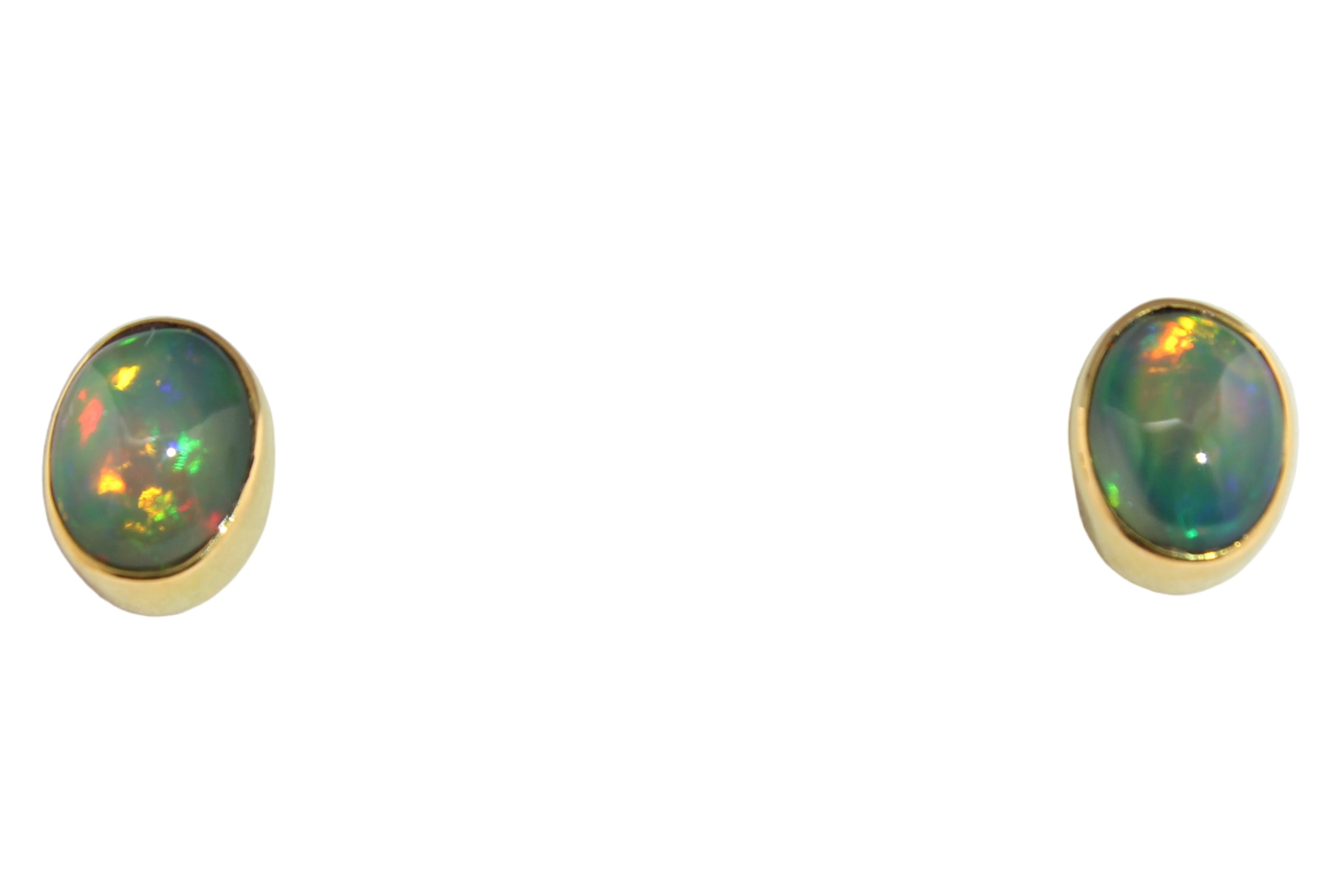 Pair of oval Ethiopian opal stud earrings featuring vibrant flashes of red, green, and gold, set in handcrafted 22k gold bezels on a white display